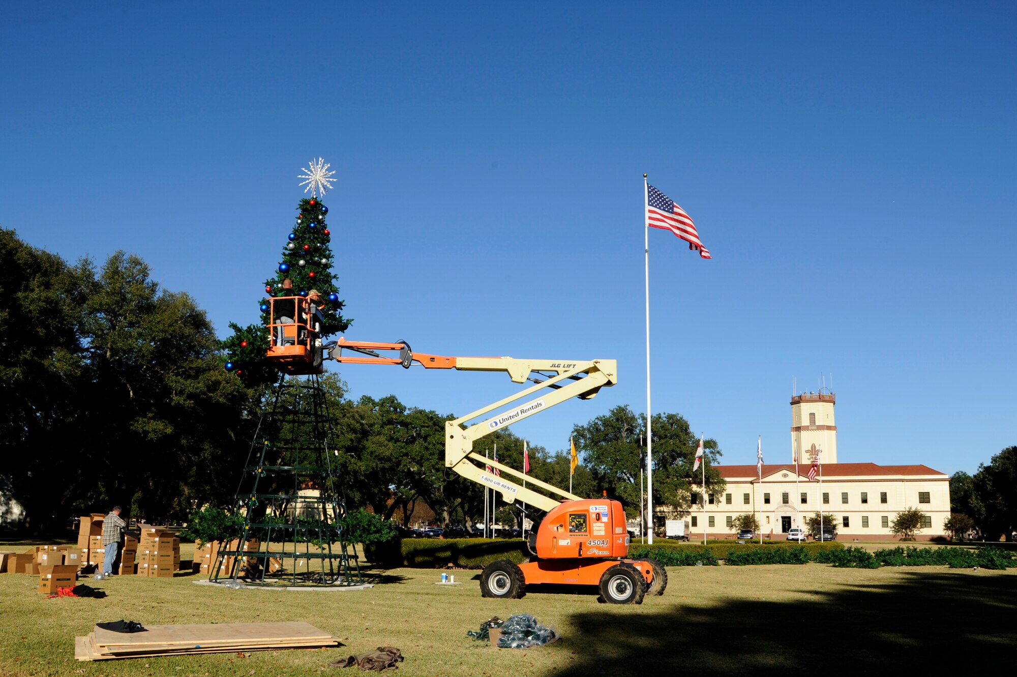 A Christmas tree is assembled in front of 2nd Bomb Wing headquarters at Barksdale Air Force Base, La., Nov. 30, 2016. There will be a tree-lighting ceremony, Dec. 8, to kick-off the start of the holiday season. (U.S. Air Force photo/Staff Sgt. Joseph A. Pagán Jr.)