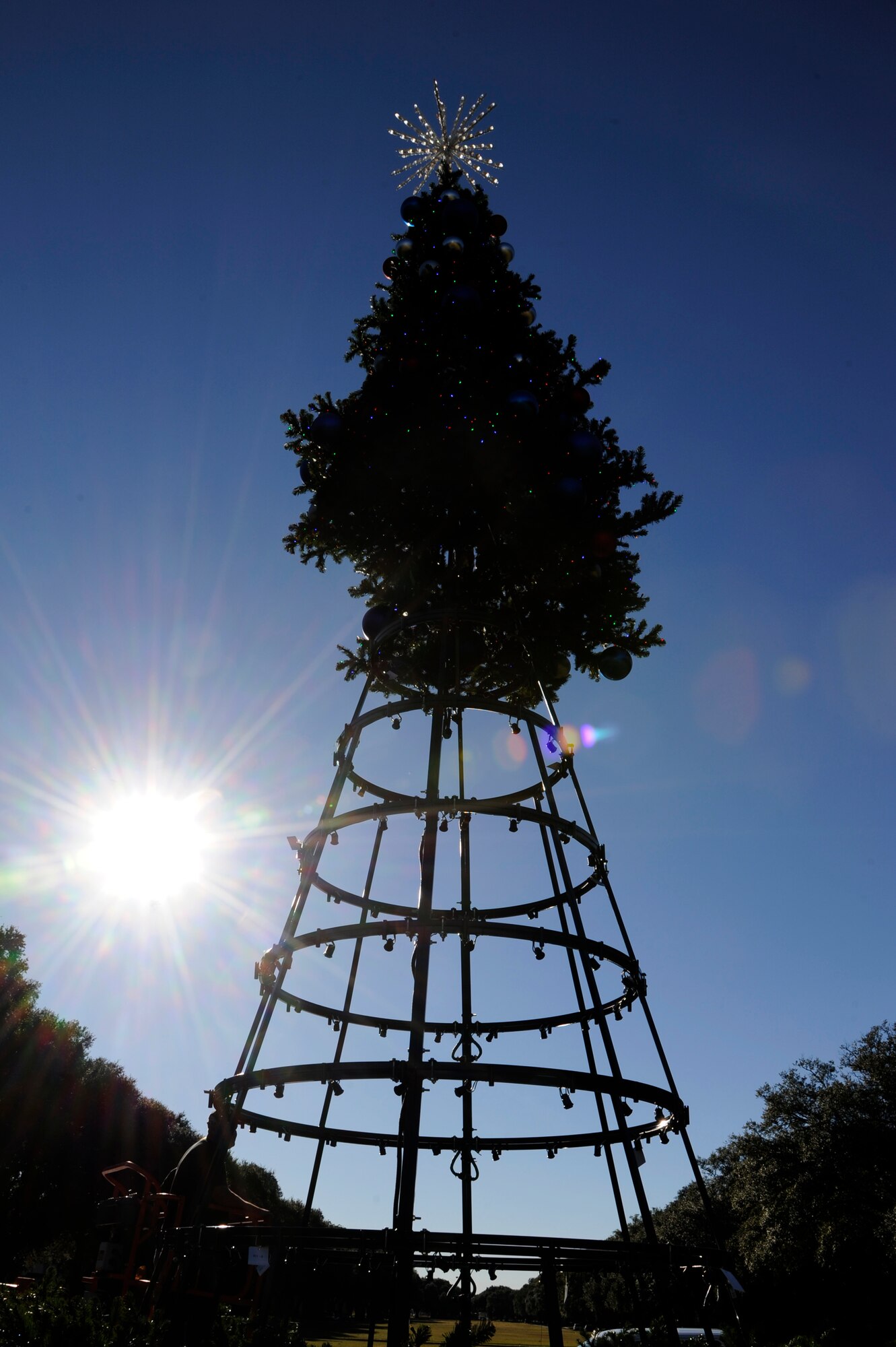 A Christmas tree is assembled in front of 2nd Bomb Wing headquarters on Barksdale Air Force Base, La., Nov. 30, 2016. The chapel will be hosting a tree lighting event on Dec. 8 to kick-off the holiday season. (U.S. Air Force photo/Staff Sgt. Joseph A. Pagán Jr.)