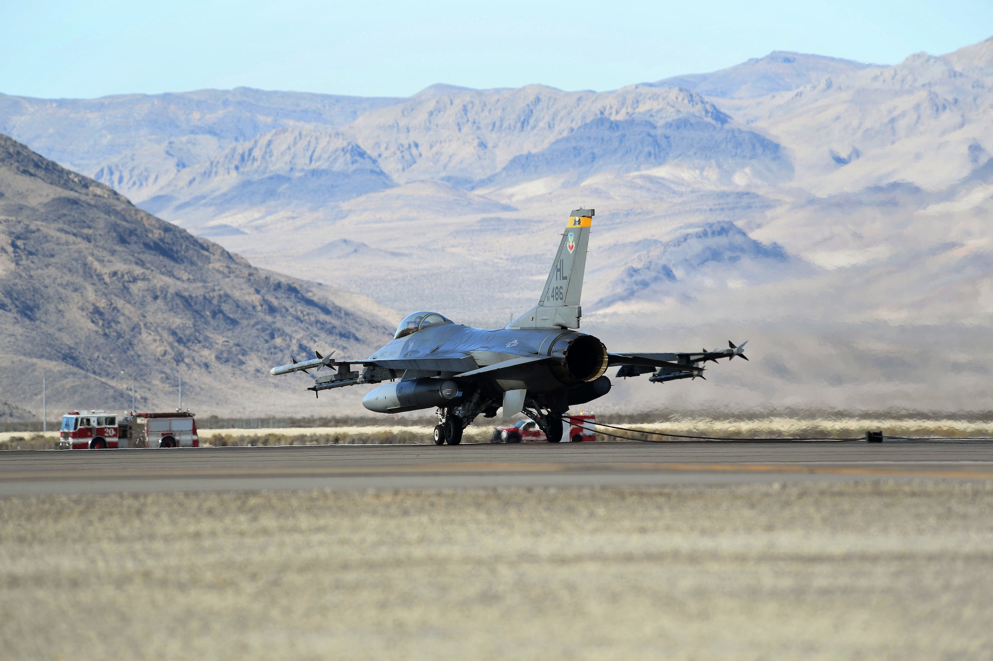 An F-16 Fighting Falcon sits on the flightline after engaging the aircraft arresting system for certification purposes Nov. 15, 2016, at Creech Air Force Base, Nev. The purpose of an active aircraft arresting system is to assist in decelerating aircraft during emergency situations. (U.S. Air Force photo by Airman 1st Class James Thompson) 