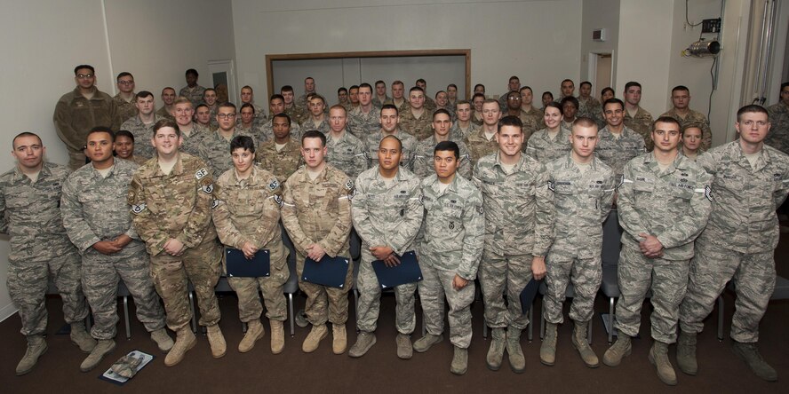 Enlisted Airmen who promoted in November pose for a group photo, Nov 30, 2016, at F.E. Warren Air Force Base, Wyo. Each month the Mighty Ninety hosts a celebration for enlisted promotees from the base.(U.S. Air Force Photo by Lan Kim)