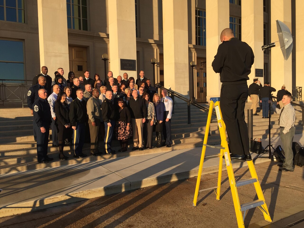 The U.S. military’s most-senior noncommissioned officers and their spouses set up for a picture in front of the Pentagon before beginning the second day of the Defense Senior Enlisted Leadership Council conference, Dec. 1, 2016. DoD photo by Jim Garamone