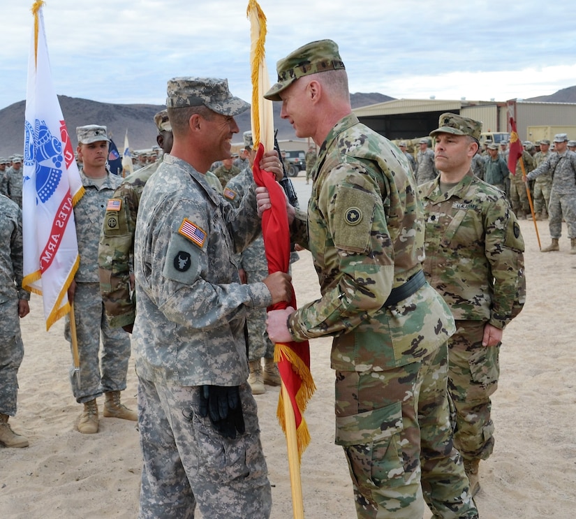 Brig. Gen. David Elwell, 311th Expeditionary Sustainment Command commanding general, traveled to the Fort Irwin National Training Center November 19, for a change of command ceremony, representing the higher command. He passed the colors to Col. Chris Barra, who is the incoming 304th Sustainment Brigade commander, during a joint Field Training Exercise for combat readiness. Combat readiness remains a high priority for U.S. Army Reserve unit throughout the Army.