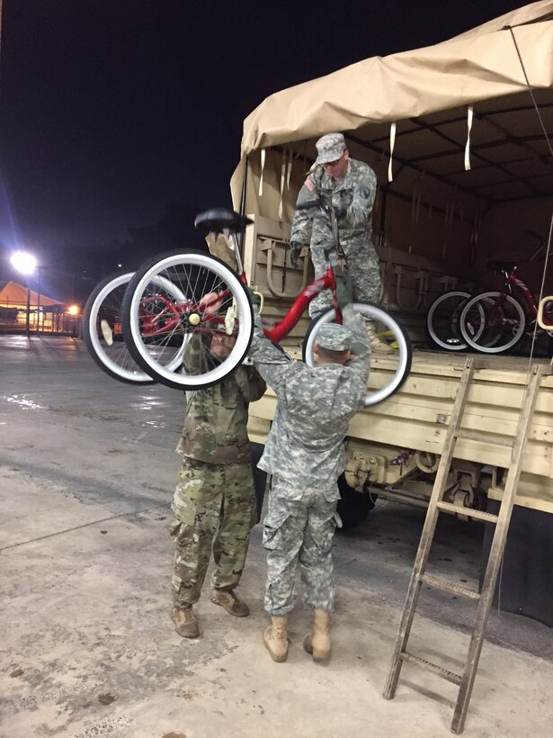 Soldiers deliver bicycles to Veterans that reside at La Casa del Veterano (House of Veterans) at Juana Diaz, Puerto Rico on November 30.