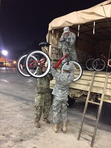 Soldiers deliver bicycles to Veterans that reside at La Casa del Veterano (House of Veterans) at Juana Diaz, Puerto Rico on November 30.