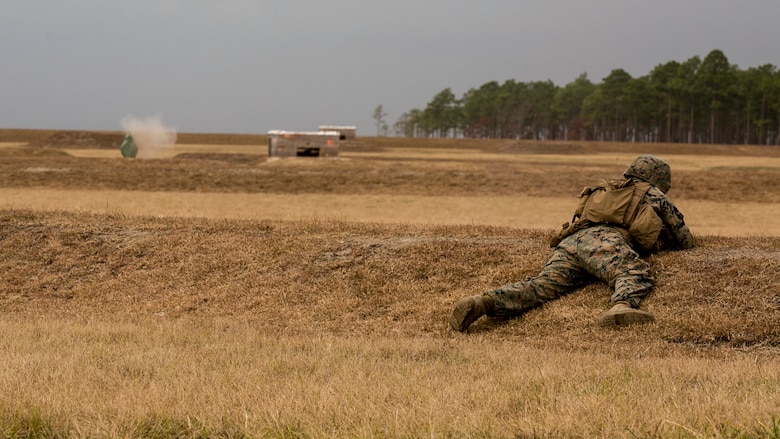 A Marine with 1st Battalion, 8th Marine Regiment. engages a target during a fire and maneuver range at Camp Lejeune, N.C., Nov. 29, 2016. The range was held in order to sharpen the fundamentals of the Marines and increase combat readiness.