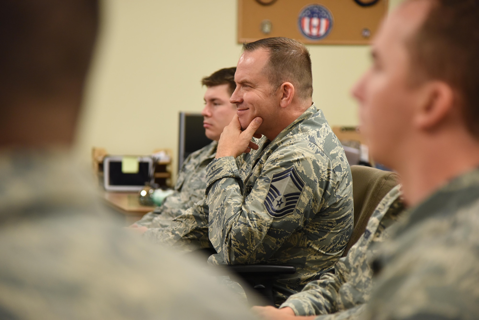 Senior Master Sgt. Marc Gibson, 81st Training Support Squadron Military Training Leader Course student, listens to Col. Michele Edmondson, 81st Training Wing commander, deliver welcoming remarks to MTL Course students at Allee Hall Nov. 29, 2016, on Keesler Air Force Base, Miss. This is the second class to attend the schoolhouse’s new four-week course curriculum, which was upped from two weeks and boasts a higher level of hands-on, practical application than its previous format. (U.S. Air Force photo by Kemberly Groue)
