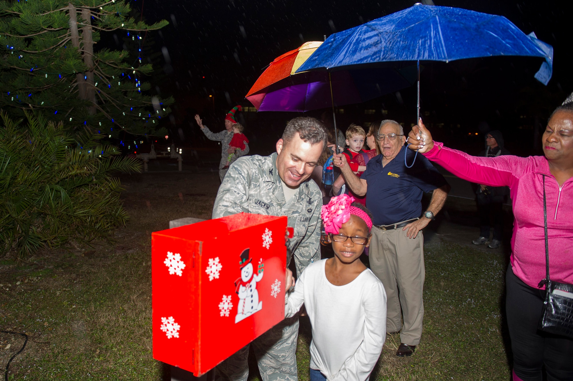 Col. Z. Walter Jackim, 45th Space Wing vice commander, assists with turning on the switch during the Christmas Tree Lighting Ceremony Nov. 30, 2016, at the Seaside Chapel at Patrick Air Force Base, Fla. In addition to the ceremony, patrons sang carols, had refreshments and socialized. (U.S. Air Force photo/Phil Sunkel)