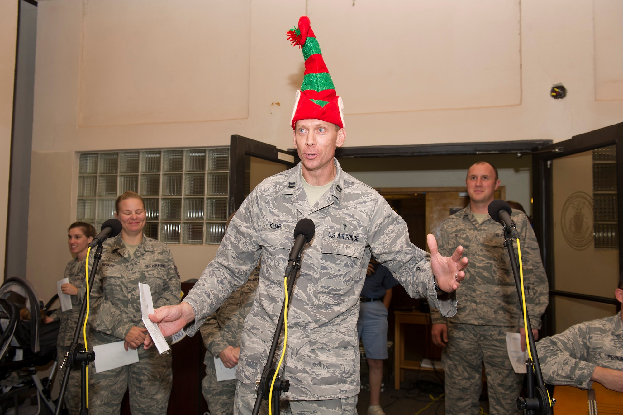 Chaplain (Capt.) Berry Kemp, 45th Space Wing, introduces Atomic Blue, a musical group, to guests during the Christmas Tree Lighting Ceremony Nov. 30, 2016, at the Seaside Chapel at Patrick Air Force Base, Fla. The band provided musical selections for Airmen and their families as part of the festivities. (U.S. Air Force photo/Phil Sunkel) 