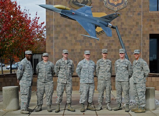 U.S. Airmen assigned to the 20th Operations Support Squadron aircrew flight equipment team are recognized by Col. Daniel Lasica, 20th Fighter Wing commander, left, and Chief Master Sgt. Christopher McKinney, 20th FW command chief, right, during an Airman Up! presentation at Shaw Air Force Base, S.C., Nov. 30, 2016. The Airmen were recognized for demonstrating perseverance, resiliency and dedication to excellence during a unit effectiveness inspection earlier this year. (U.S. Air Force photo by Airman 1st Class BrieAnna Stillman)