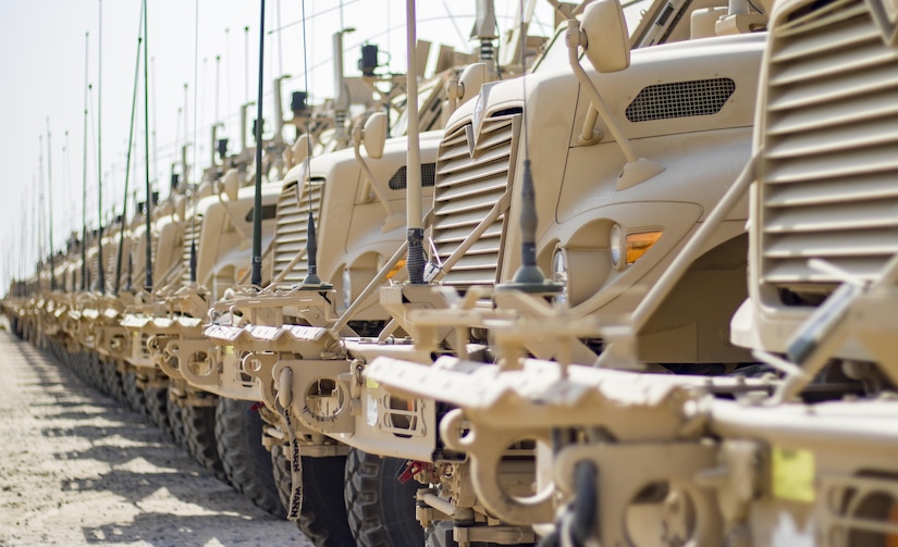 A row of Mine-Resistant Ambush Protected (MRAP) vehicles are ready and waiting in lots maintained by the 401st Field Support Brigade on Oct. 22, 2016 at Camp Arifjan, Kuwait. The 401st AFSB is a forward presence of the U.S. Army Sustainment Command (ASC) that provides equipment and material for troops all over U.S. Central Command’s area of operations. (U.S. Army photo by Sgt. Angela Lorden)