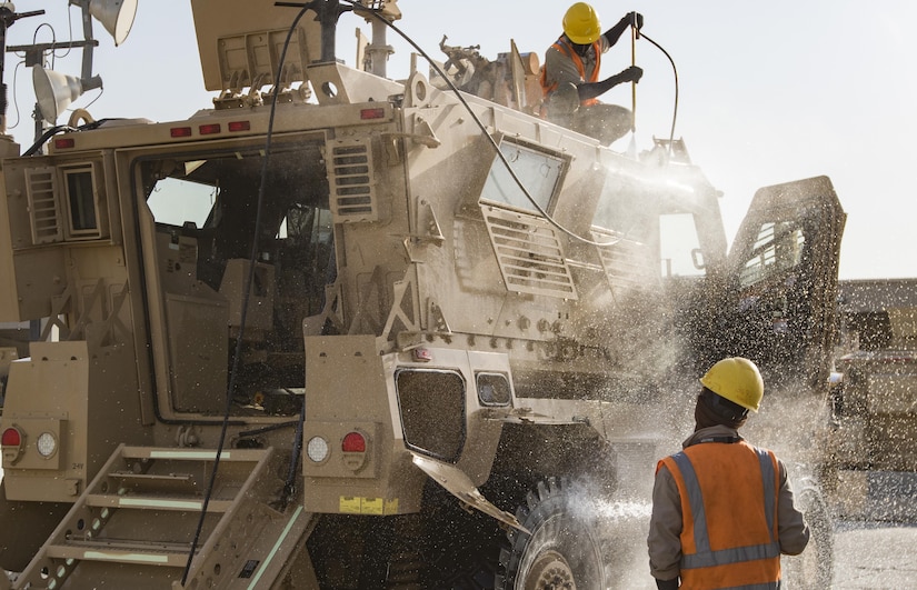 Civilian contractors provide equipment maintenance for the Army Prepositioned Stocks – Kuwait (APS-5 Kuwait) on Oct. 22, 2016 at Camp Arifjan, Kuwait. The 401st Army Field Support Brigade implements the APS-5 Kuwait program which maintains thousands of pieces of prepositioned, combat-ready equipment for the U.S. Central Command’s area of operations. (U.S. Army photo by Sgt. Angela Lorden)