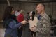 Laura Papetti, KREM 2 News anchor reporter, interviews Col. Ryan Samuelson, 92nd Air Refueling Wing commander, about Fairchild’s involvement in the Treats 2 Troops program Dec. 1, 2016 at Fairchild Air Force Base. Team Fairchild volunteers packaged more than 400 care packages that will be delivered to deployed military members. (U.S. Air Force photo/Senior Airman Nick J. Daniello)