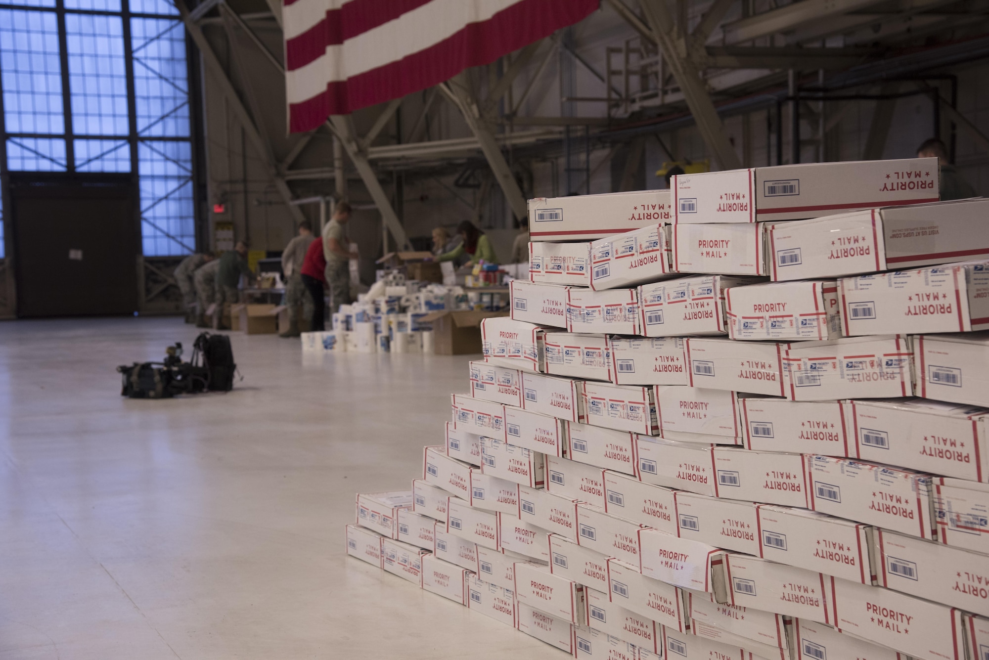 Team Fairchild volunteers pack more than 400 care packages for deployed military members as part of a KREM 2 News Station initiative, Treats 2 Troops, Dec. 1, 2016 at Fairchild Air Force Base. The care packages are filled with small treats and items such as beef jerky, sanitizer wipes, lens cleaning cloths, shampoo and hand-held games. (U.S. Air Force photo/Senior Airman Nick J. Daniello)