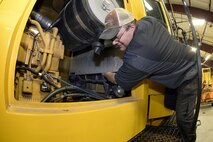 Tom Giles, 75th Logistics Readiness Squadron, performs maintenance on a blower truck in the snow barn at Hill Air Force Base, Dec. 1. These trucks and other snow removal vehicles are kept in top shape to fulfill their mission of keeping the airfield here operational during any weather conditions. (U.S. Air Force photos by Todd Cromar)