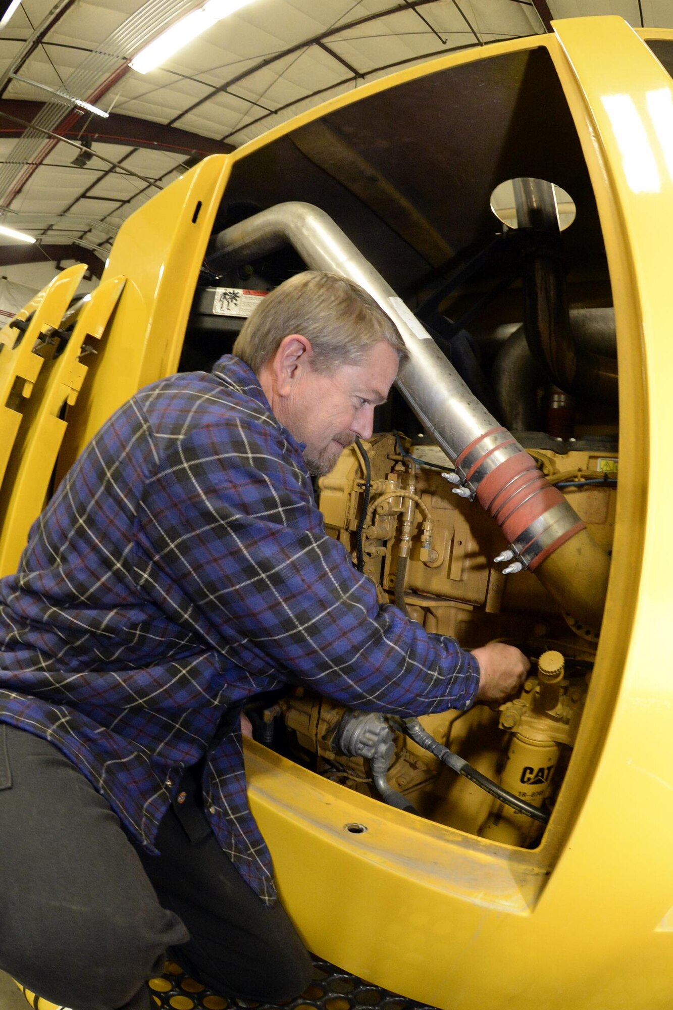 Delane Vaughn, 75th Logistics Readiness Squadron, performs maintenance on a blower truck in the snow barn at Hill Air Force Base, Dec. 1. The 75th LRS snow removal team prides itself on being the best in the Air Force (U.S. Air Force photos by Todd Cromar)