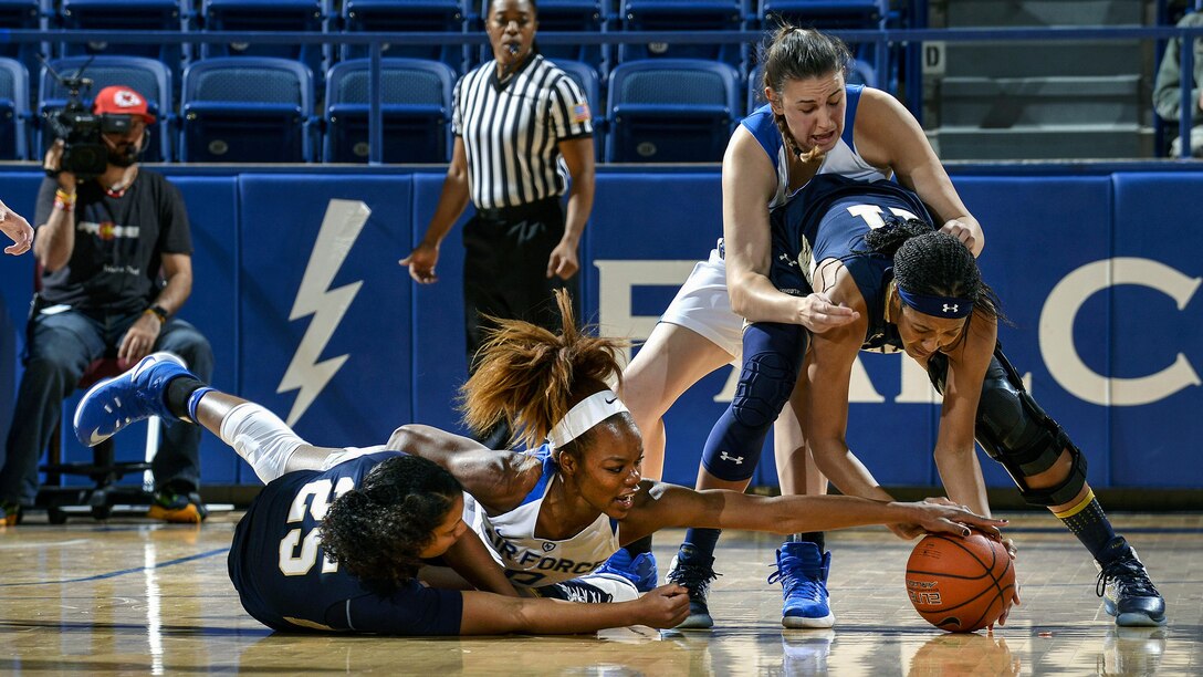 <strong>Photo of the Day: Dec. 2, 2016</strong><br/><br />Dee Bennett, a junior, battles for the ball as Air Force hosted Navy at the U.S. Air Force Academy in Colorado Springs, Colo., Nov. 29, 2016.  The Midshipmen defeated the Falcons, 64-46. Air Force photo by Jason Gutierrez<br/><br /><a href="http://www.defense.gov/Media/Photo-Gallery?igcategory=Photo%20of%20the%20Day"> Click here to see more Photos of the Day. </a> 