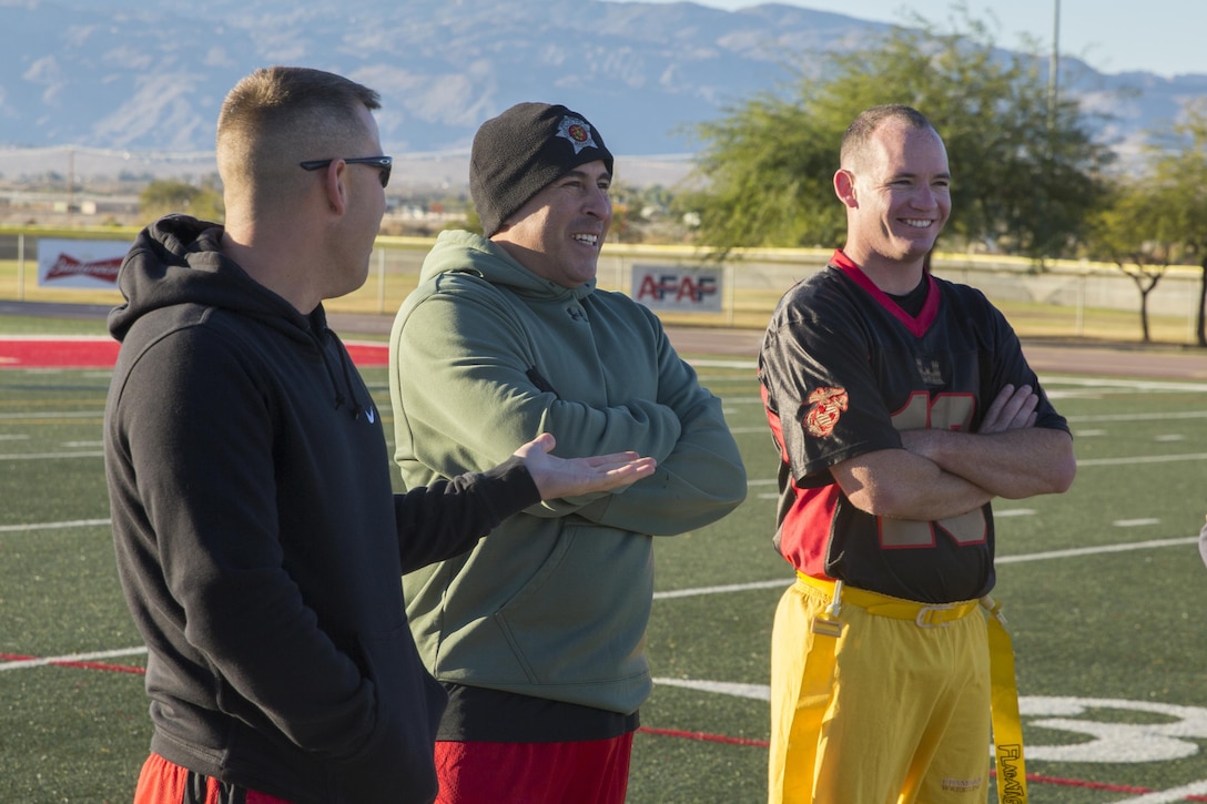 Officers of Marine Wing Support Squadron 374 take a break during half time of the MWSS-374 Turkey Bowl at Felix Field aboard the Marine Corps Air Ground Combat Center, Twentynine Palms, Calif., Nov. 22, 2016. MWSS-374 held the Turkey Bowl to build camaraderie within the senior leadership.  (Official Marine Corps photo by Lance Cpl. Dave Flores/Released)