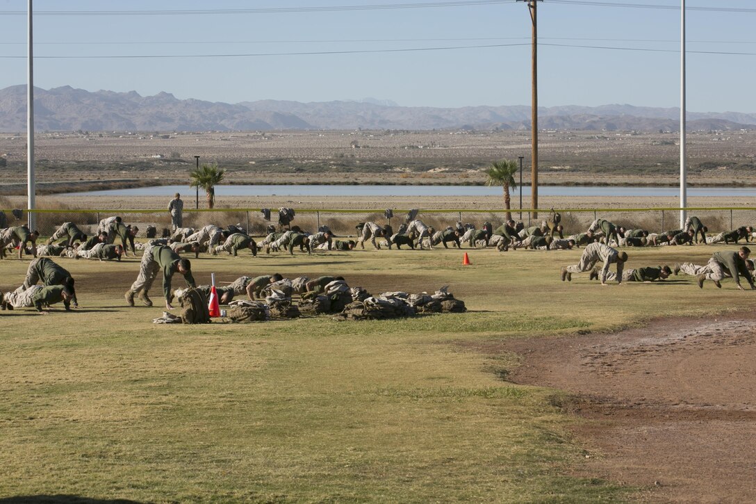 Marines of 1st Tank Battalion conduct physical training during the battalion’s operational pause at Del Valle Field aboard the Marine Corps Air Ground Combat Center, Twentynine Palms, Calif., Nov. 29, 2016. (Official Marine Corps photo by Cpl. Thomas Mudd/Released)