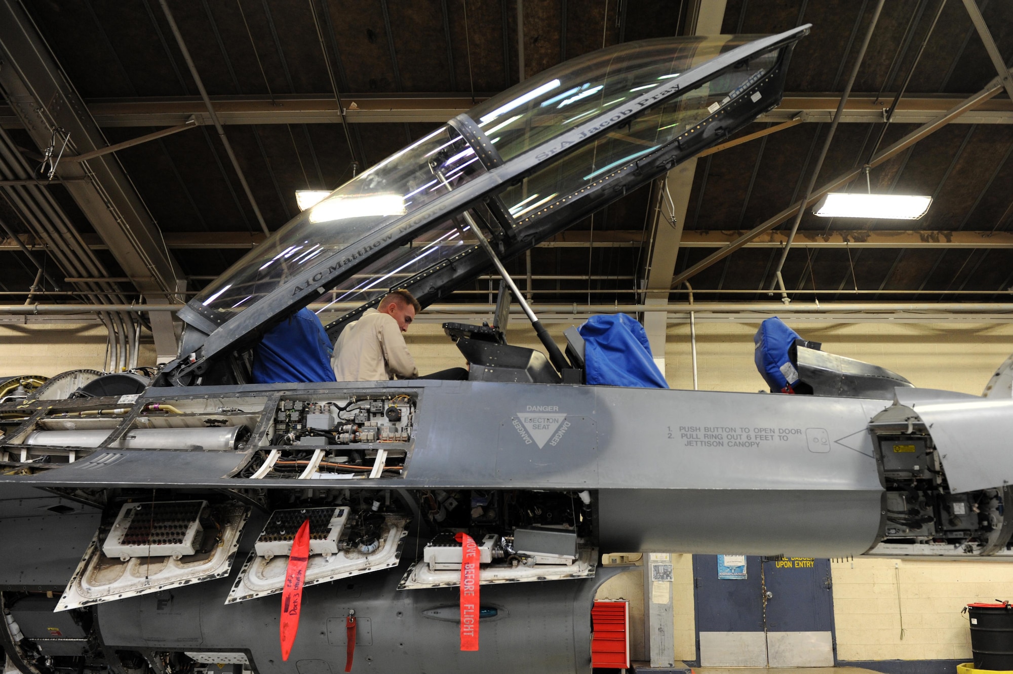 SrA Parker Hovis, 309th Aircraft Maintenance Unit crew chief, installs a side wall faring Nov. 23, 2016 at Luke Air Force Base, Ariz. The side wall faring is tightened and secured to avoid falling debris in the hull of the aircraft. (U.S. Air Force photo by Airman 1st Class Pedro Mota)  