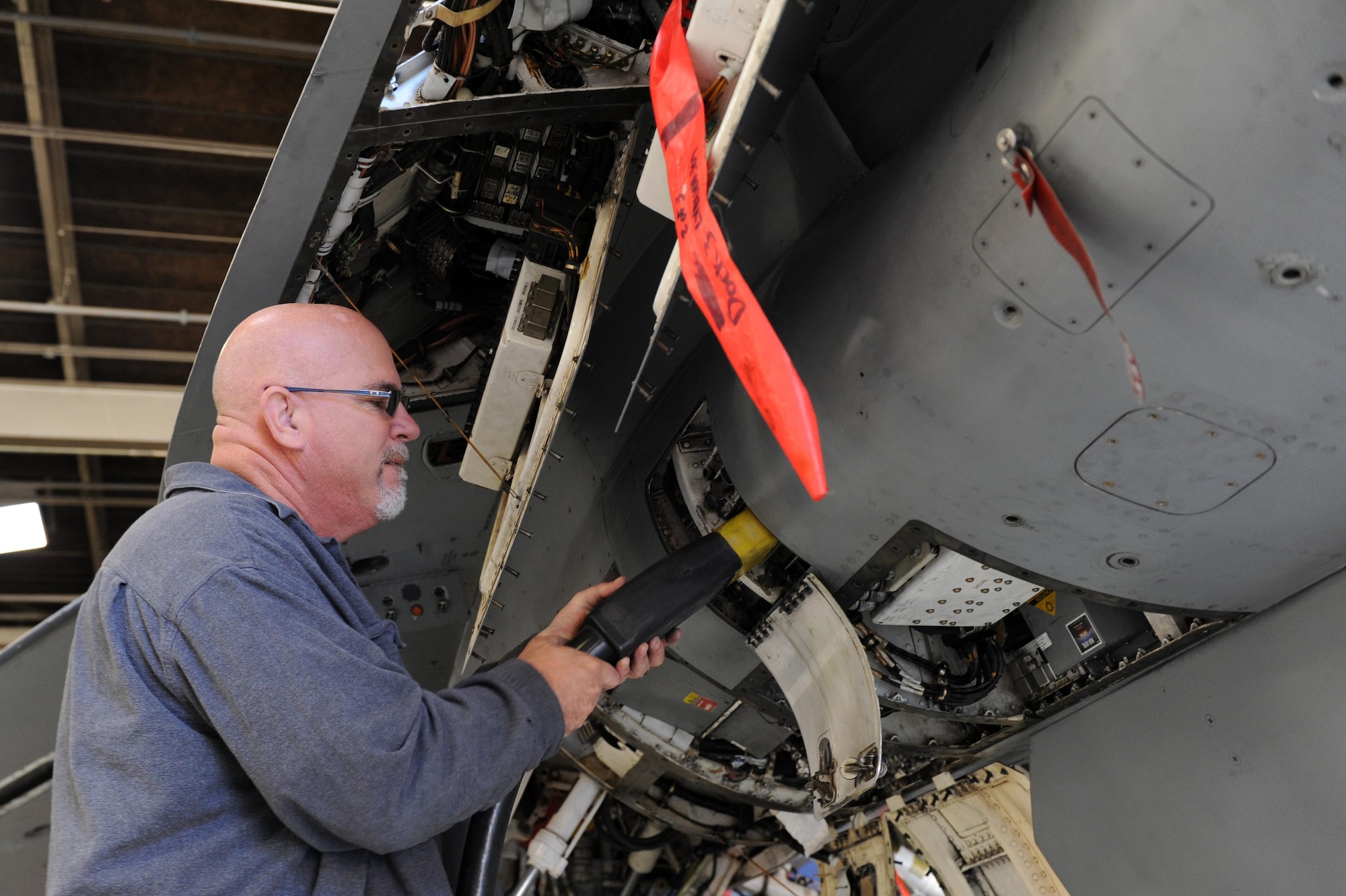 Donald Wiever, 56th Equipment Maintenance Squadron avionics technician, plugs in an external power supply to an F-16 Fighting Falcon Nov. 23, 2016 at Luke Air Force Base, Ariz. The external power supply allows maintenance personnel to perform function checks without starting the aircraft. (U.S. Air Force photo by Airman 1st Class Pedro Mota)  