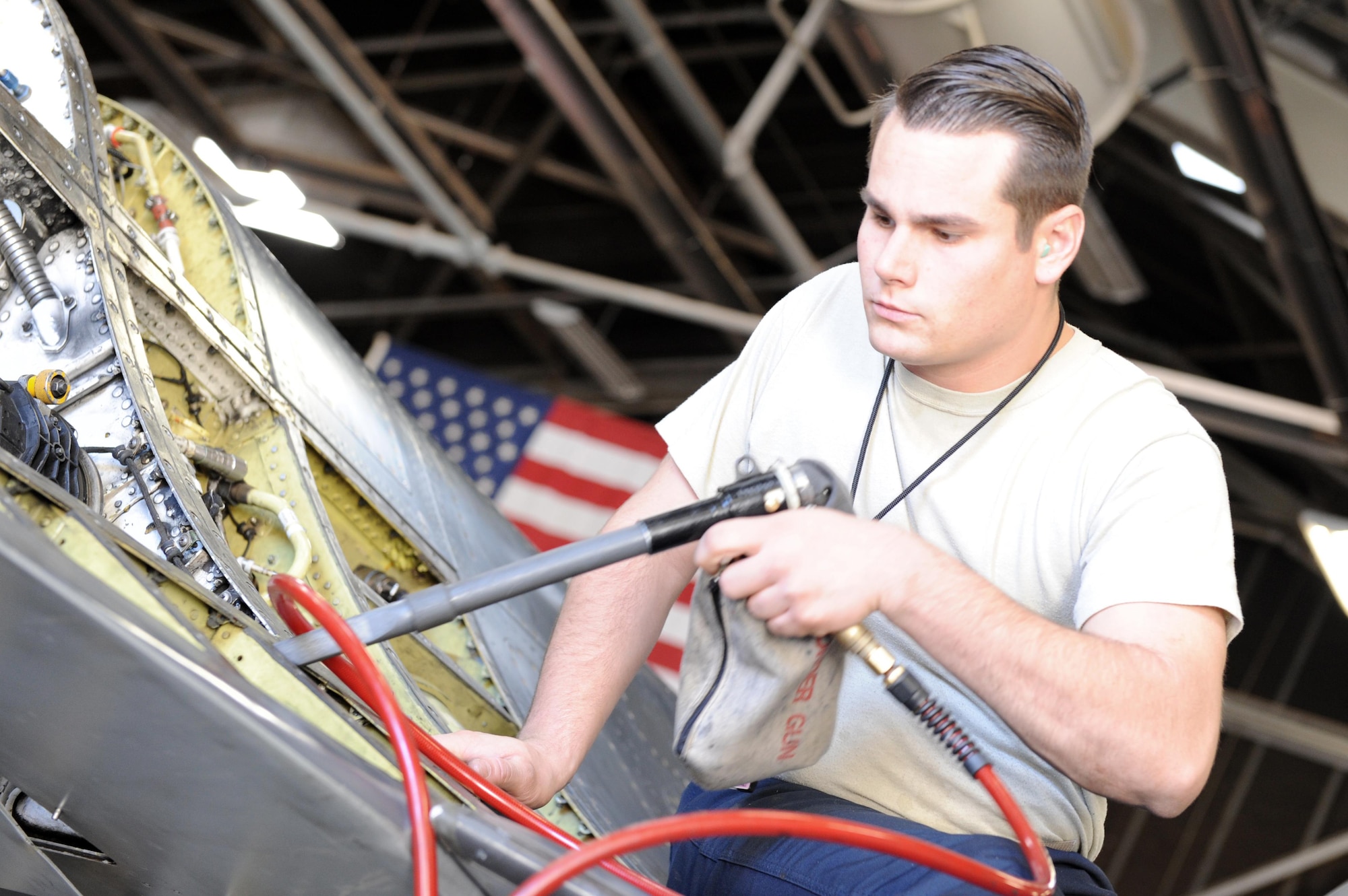 Staff Sgt. Donovan Parameter, 56th Equipment Maintenance Squadron phase team member, vacuums debris out of an F-16 Fighting Falcon Nov. 23, 2016 at Luke Air Force Base, Ariz.(U.S. Air Force photo by Airman 1st Class Pedro Mota)    