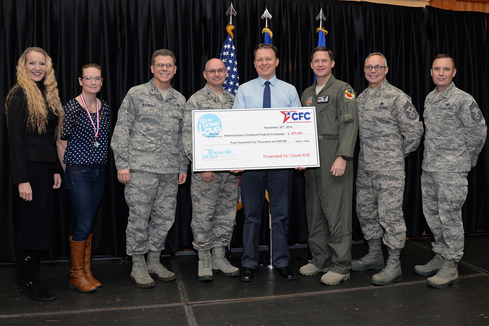 Team Hill and CFC leaders hold a $405,000 ‘check’ during a CFC key worker recognition breakfast Nov. 30 at Hill Air Force Base. The base’s goal is $500,000 by Dec. 15. (U.S. Air Force photo by Alex R. Lloyd)