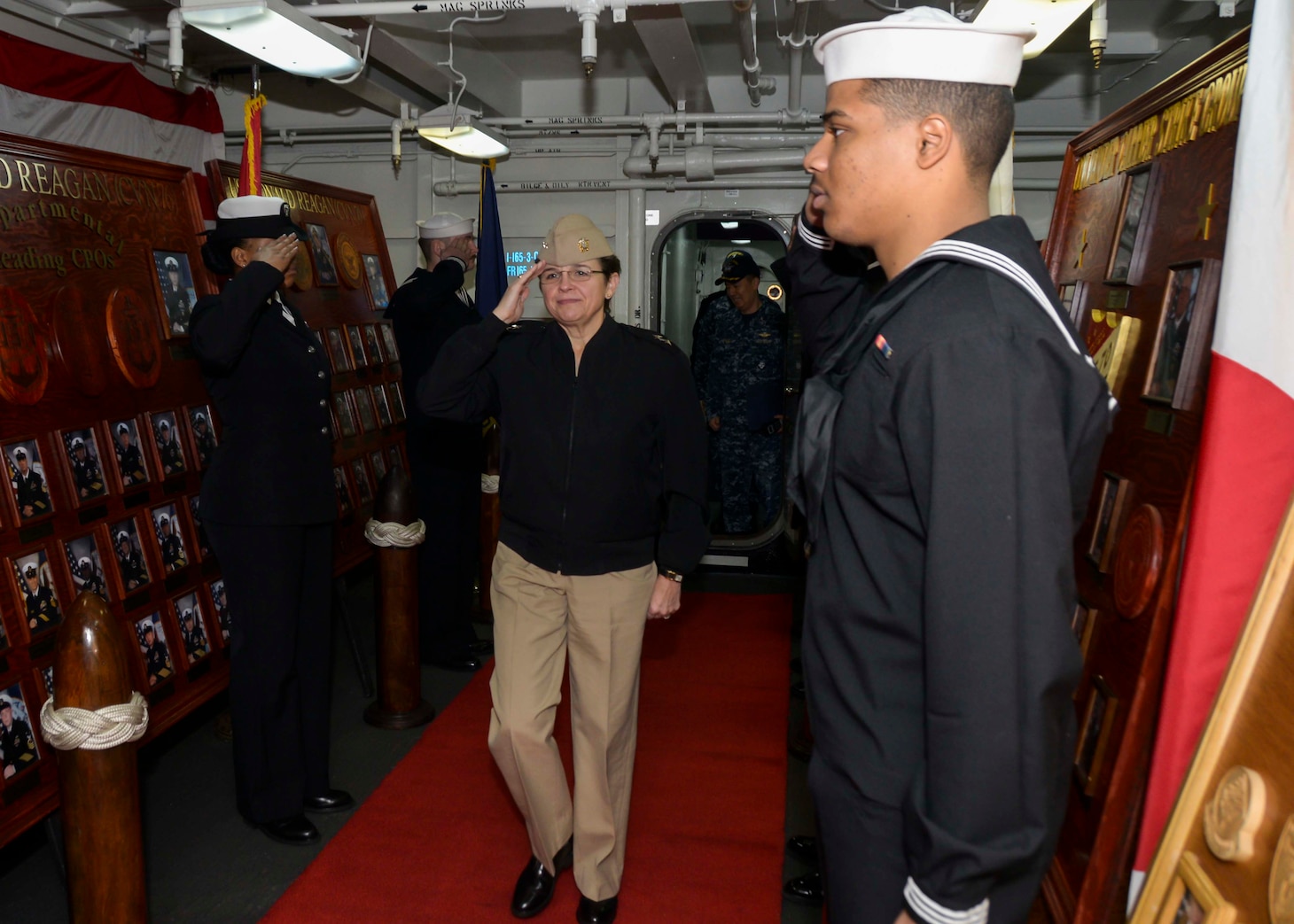 YOKOSUKA, Japan (Dec. 1, 2016) Navy Chief of Chaplains, Rear Adm. Margaret G. Kibben, salutes side boys as she arrives aboard the Navy’s only forward-deployed aircraft carrier, USS Ronald Reagan (CVN 76). Kibben, the first female two-star chaplain and first female Navy Chief of Chaplains, met with leadership from Reagan Carrier Strike Group (CSG) 5 to get a first-hand account of their religious-ministries programs. Ronald Reagan, the flagship of CSG 5, provides a combat-ready force that protects and defends the collective maritime interests of its allies and partners in the Indo-Asia-Pacific region.