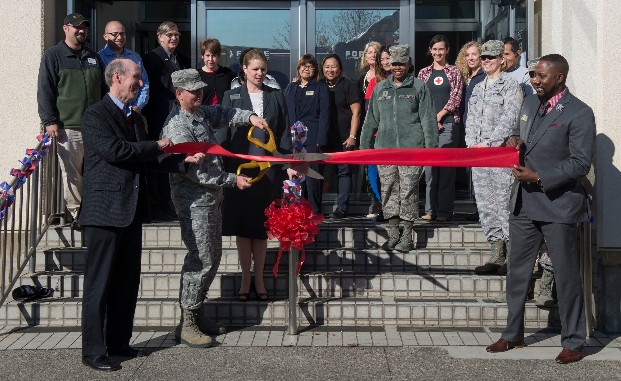 U.S. Air Force Col. Neil R. Richardson, 374th Airlift Wing vice commander, cuts the ribbon of the Airman & Family Readiness Center reopening ceremony Nov. 29, 2016, at Yokota Air Base, Japan. The AFRC assists individuals and families providing workshops and consultations enhancing resiliency, readiness, and self-sufficiency. (U.S. Air Force photo by Airman 1st Class Juan E. Torres/Released)
