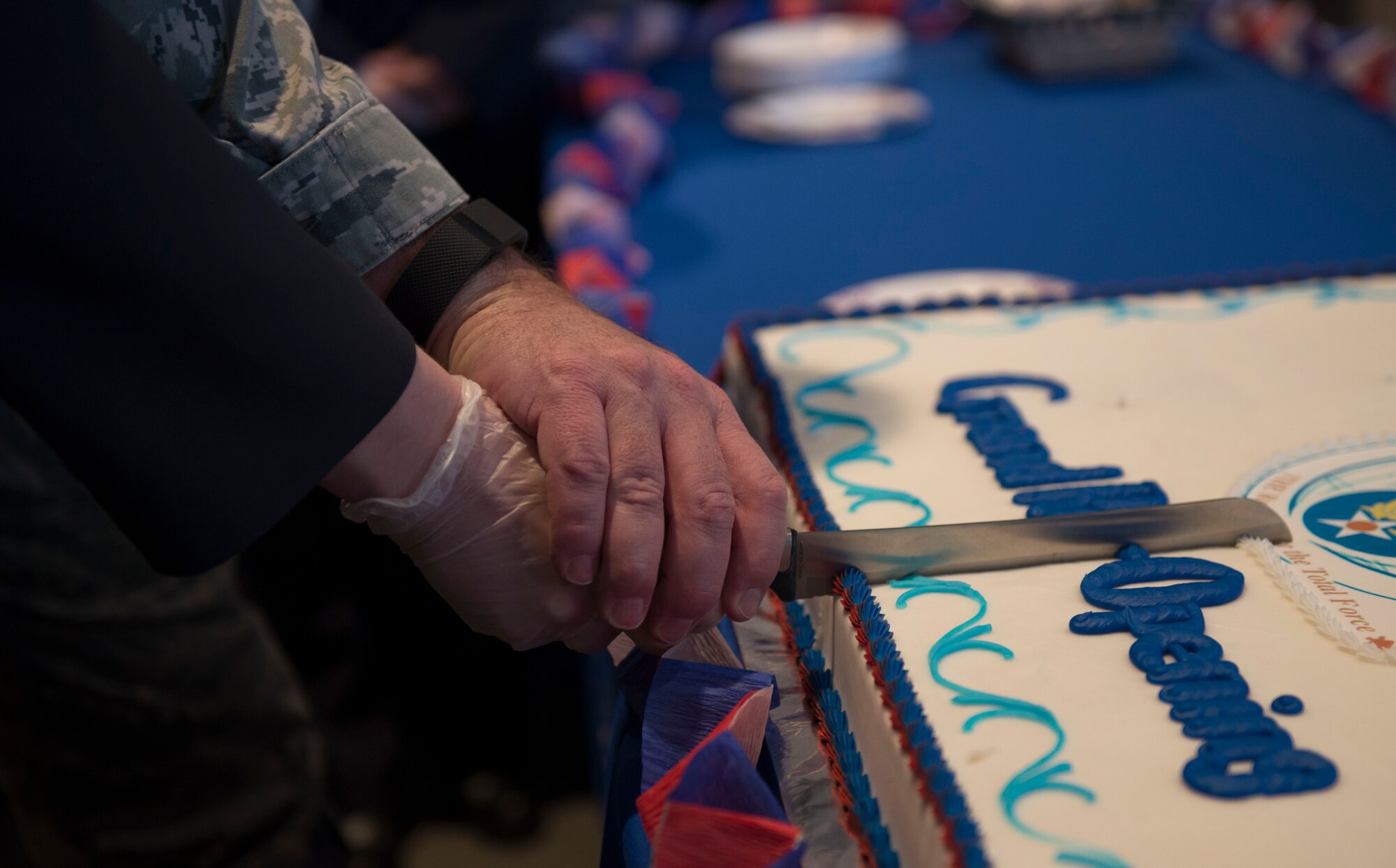 Sonya R. Meier, chief of the Airman & Family Readiness Center, and U.S. Air Force Col. Neil R. Richardson, 374th Airlift Wing vice commander, cut the cake of the AFRC reopening ceremony Nov. 29, 2016, at Yokota Air Base, Japan. The AFRC assists individuals and families providing workshops and consultations enhancing resiliency, readiness, and self-sufficiency. (U.S. Air Force photo by Airman 1st Class Juan E. Torres/Released)