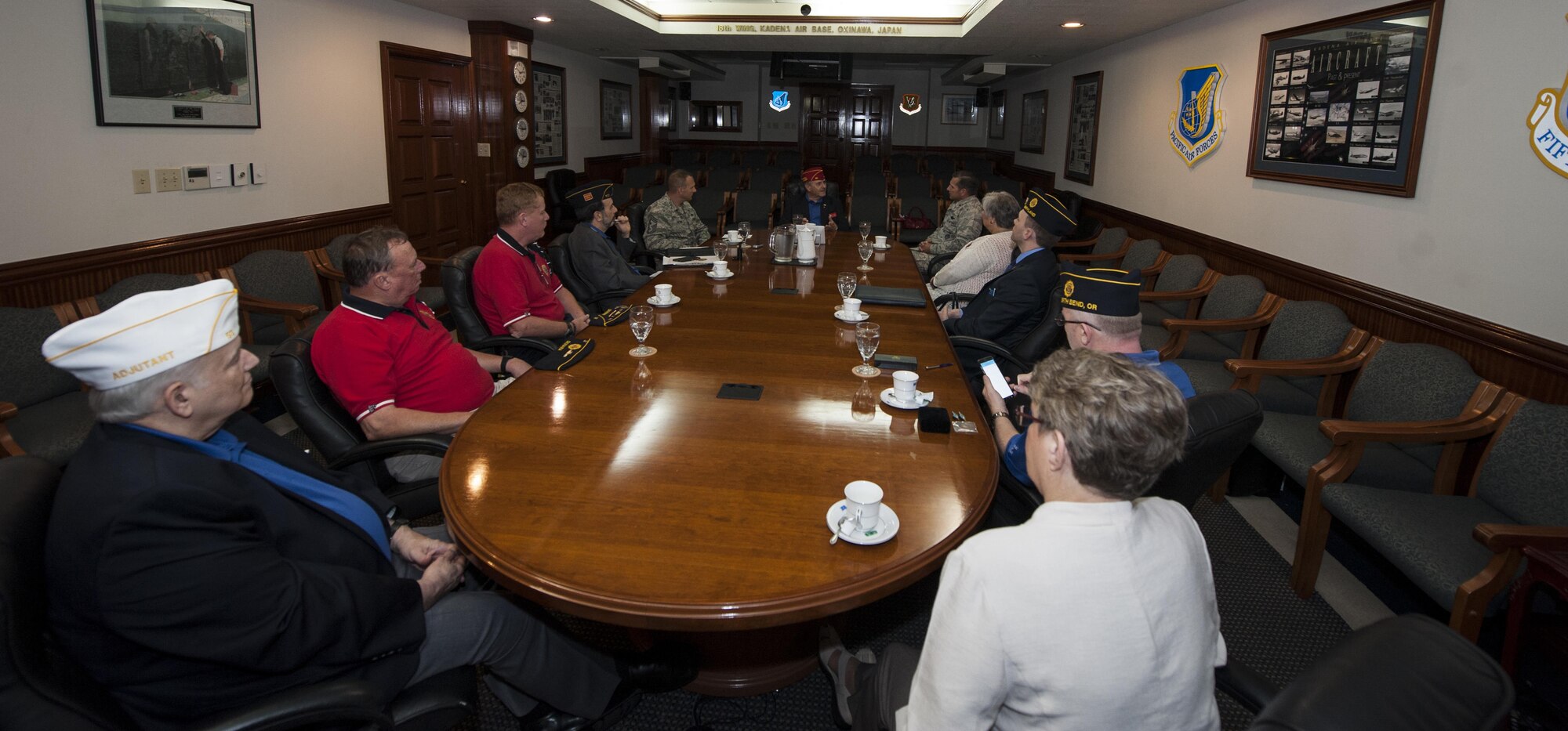 Charles Schmidt, American Legion National Commander, speaks with Brig. Gen. Barry Cornish, 18th Wing commander, Nov. 28, 2016, at Kadena Air Base, Japan. The American Legion is an organization focused on caring for veterans past and present. (U.S. Air Force photo by Senior Airman Lynette M. Rolen/Released)