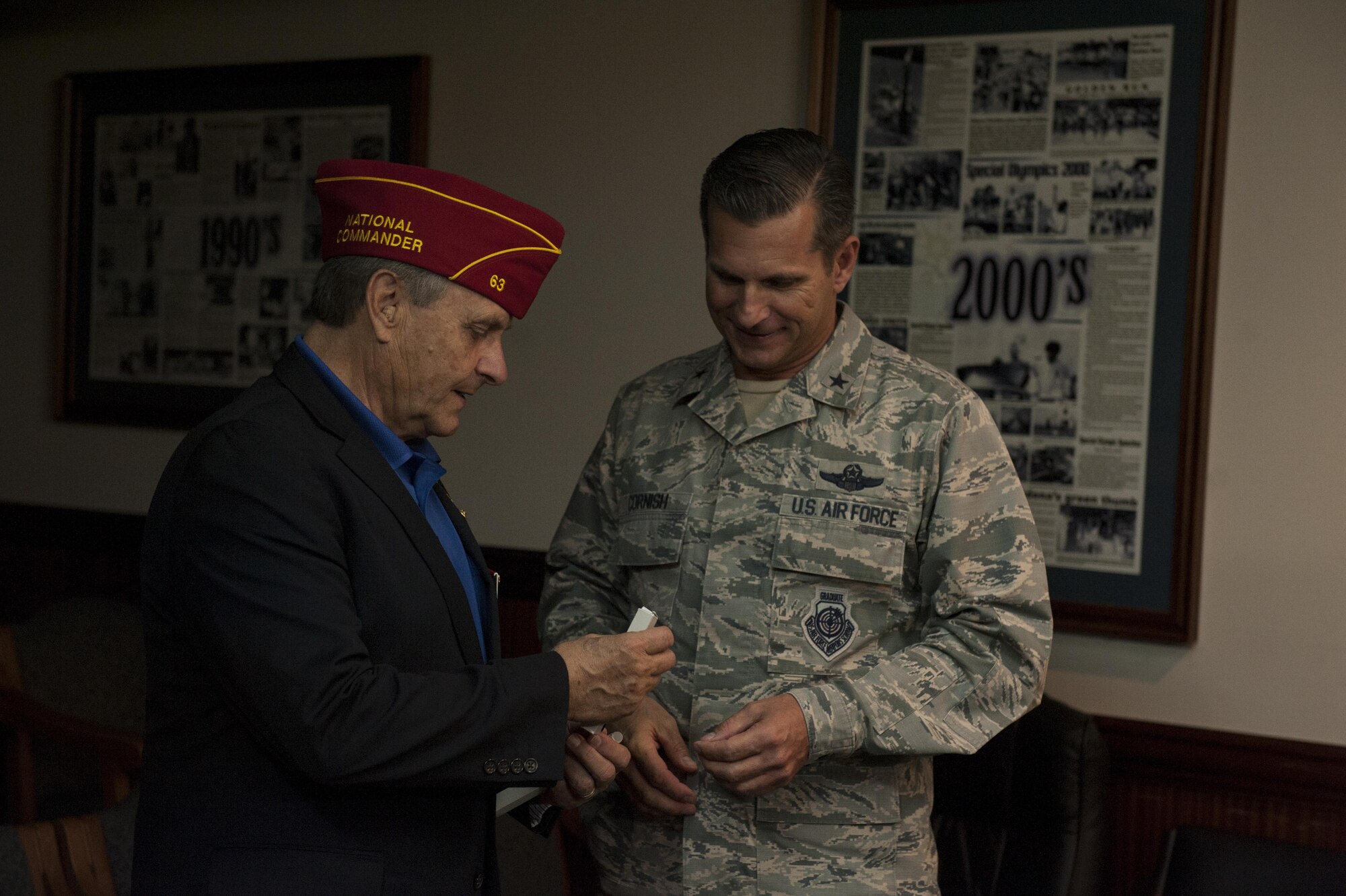 Charles Schmidt, American Legion National Commander, presents Brig. Gen Barry Cornish, 18th Wing commander, with an American Legion pen Nov. 28, 2016, at Kadena Air Base, Japan. The American Legion presents multiple gifts to service members as a show of appreciation for the contributions to national security. (U.S. Air Force photo by Senior Airman Lynette M. Rolen/Released)