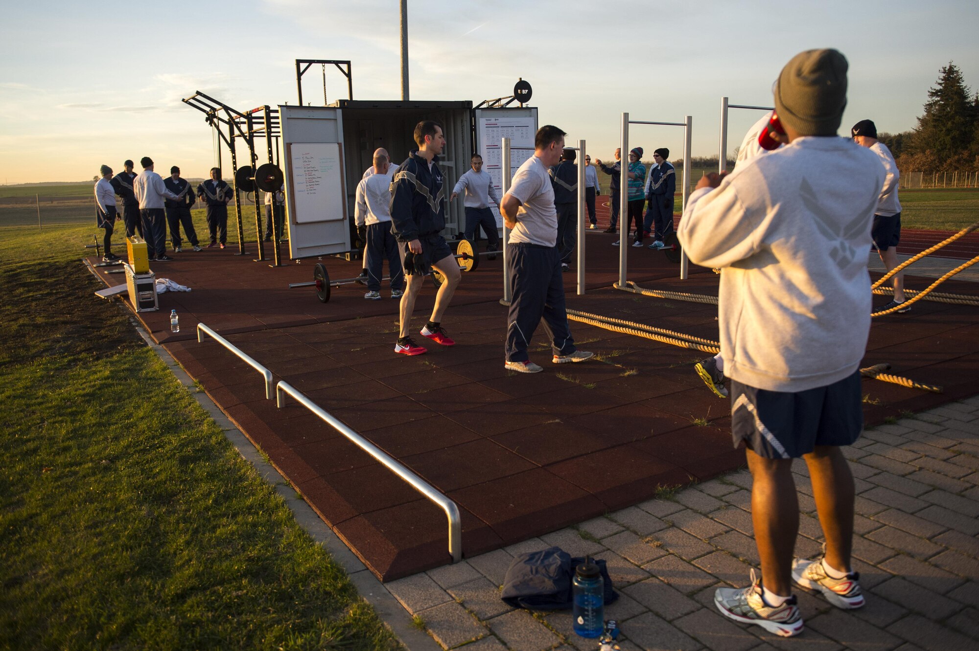 Airmen from the 52nd Fighter Wing participate in physical training with the new Fitness-In-A-Box outside the Powerhaus Fitness Center on Spangdahlem Air Base, Germany, Nov. 30, 2016. The Airman utilized the new system which contains strength and conditioning training equipment in a lockable storage locker. (U.S. Air Force photo by Airman 1st Class Preston Cherry)