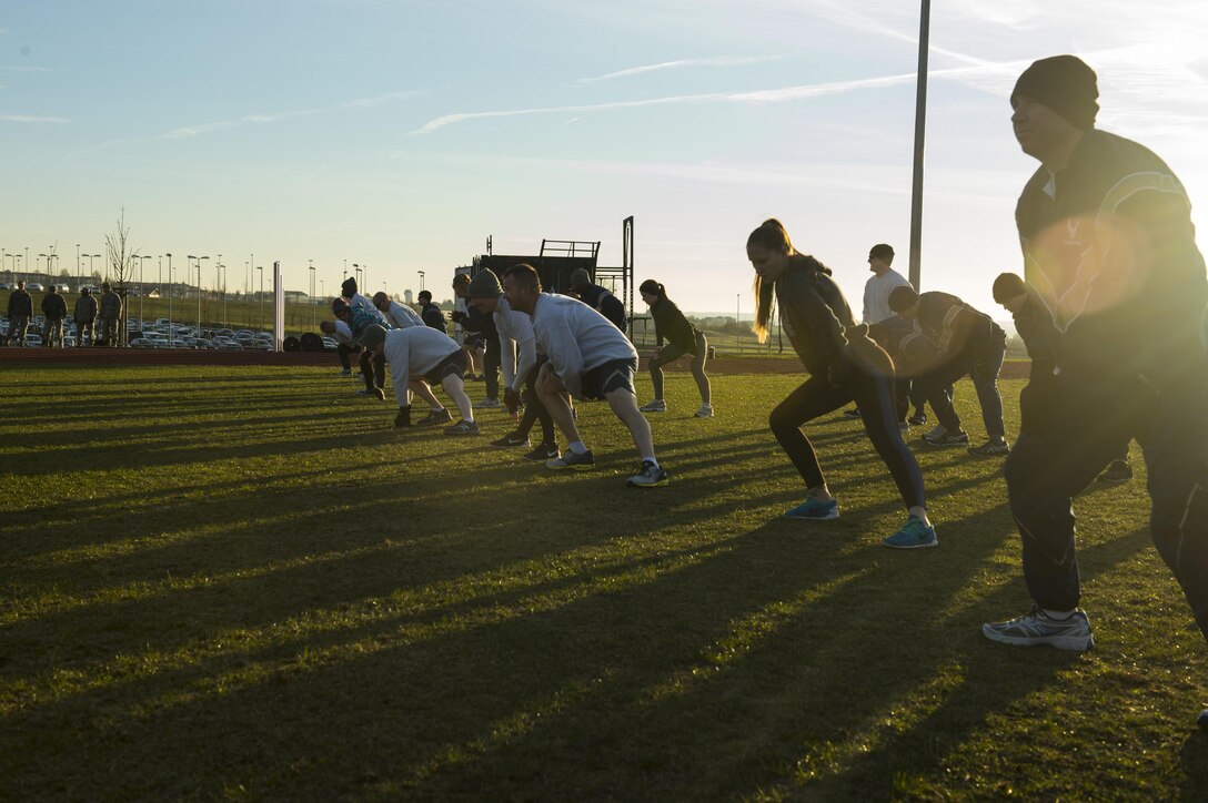 Airmen from the 52nd Fighter Wing warm up before working out using the new Fitness-In-A-Box outside the Powerhaus Fitness Center on Spangdahlem Air Base, Germany, Nov. 30, 2016. . With the funding from the Commander in Chief’s Installation Excellence Award, the 52nd FW purchased, Fitness-In-A-Box, a military exercise unit containing strength and conditioning training equipment in a lockable storage locker. (U.S. Air Force photo by Senior Airman Dawn M. Weber)