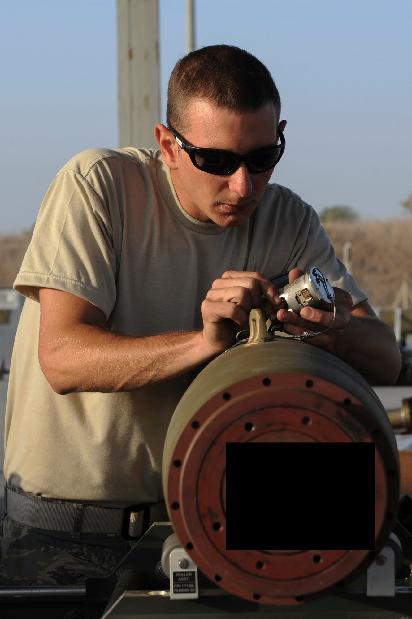 U.S. Air Force Staff Sgt. Benjamin, a 447th Expeditionary Aircraft Maintenance Squadron munitions systems journeyman, plugs in a component on a GBU-54 Laser Joint Direct Attack Munition bomb Oct. 29, 2016, at Incirlik Air Base, Turkey. The bombs built and delivered by the Airmen are used in Operation INHERENT RESOLVE. (U.S. Air Force photo by Airman 1st Class Devin M. Rumbaugh) (Portions of this image are blocked for security concerns)