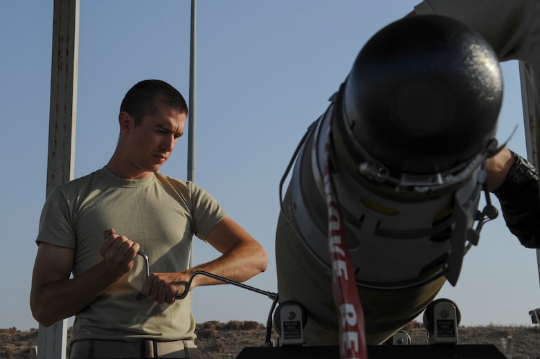 A U.S. Air Force Airman, assigned to the 447th Expeditionary Aircraft Maintenance Squadron, tightens a bolt on a GBU-54 Laser Joint Direct Attack Munition bomb Oct. 29, 2016, at Incirlik Air Base, Turkey. The Airmen aide Operation INHERENT RESOLVE by building and supplying munitions. (U.S. Air Force photo by Airman 1st Class Devin M. Rumbaugh)