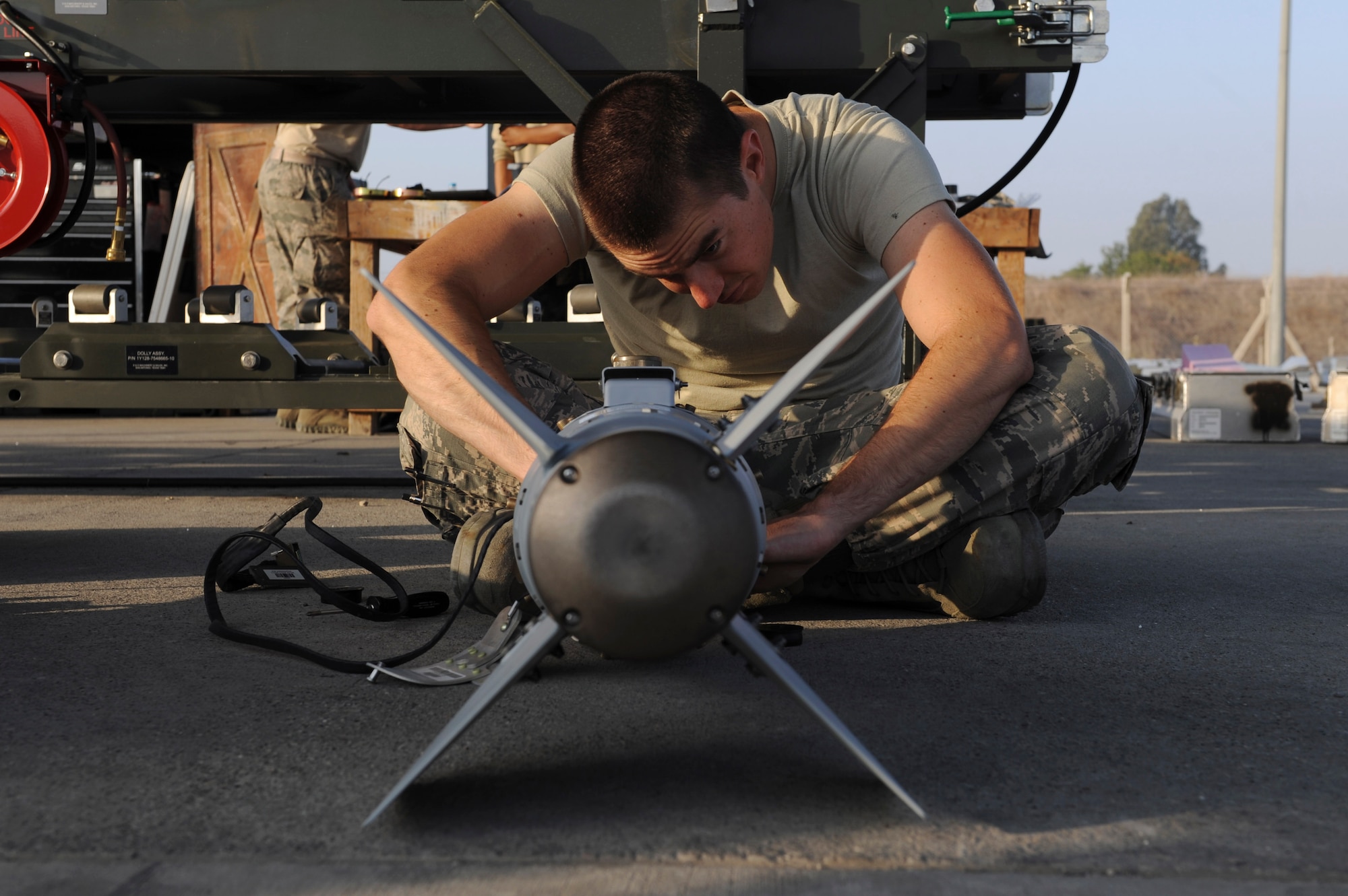 A U.S. Air Force Airman, assigned to the 447th Expeditionary Aircraft Maintenance Squadron, prepares the tail section of a GBU-54 Laser Joint Direct Attack Munition bomb Oct. 29, 2016, at Incirlik Air Base, Turkey. The bombs are tested before either being loaded onto aircraft or placed in a storage area. (U.S. Air Force photo by Airman 1st Class Devin M. Rumbaugh)
