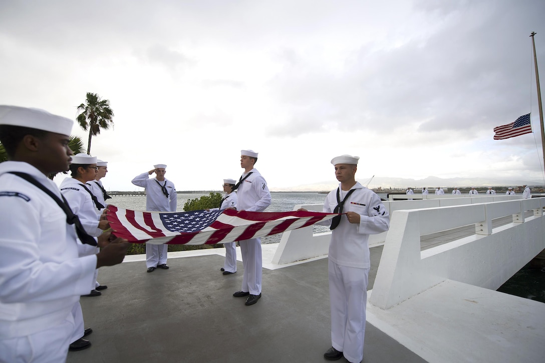 Sailors participate in an ash-scattering ceremony following the death of Pearl Harbor attacks survivor Jack A. Stoeber at the USS Utah Memorial, Hawaii, Dec. 1, 2016. On Dec. 7, 1941, Stoeber was serving aboard the USS Whitney in Pearl Harbor. Navy photo by Petty Officer 2nd Class Gabrielle Joyner