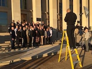 The U.S. military’s most-senior noncommissioned officers and their spouses set up for a picture in front of the Pentagon before beginning the second day of the Defense Senior Enlisted Leadership Council conference, Dec. 1, 2016. DoD photo by Jim Garamone 