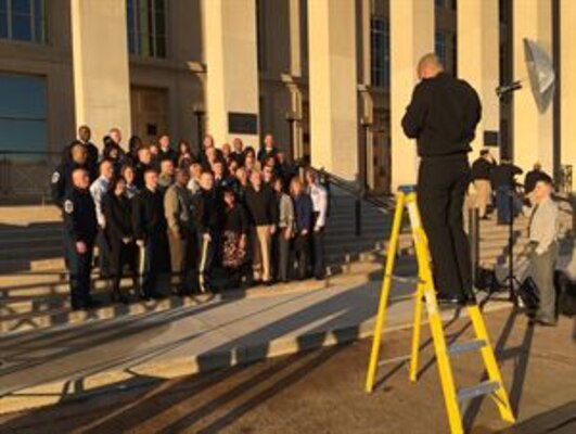 The U.S. military’s most-senior noncommissioned officers and their spouses set up for a picture in front of the Pentagon before beginning the second day of the Defense Senior Enlisted Leadership Council conference, Dec. 1, 2016. DoD photo by Jim Garamone 