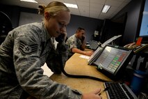 Staff Sgt. Paris Jepko, Command Post 42nd Air Base Wing noncommissioned officer in charge of reports, and Tech. Sgt. Donald Bridgers, Command Post 908th Airlift Wing NCOIC of reports, answer phone calls Sept. 14, 2016, Maxwell Air Force Base, Ala. The Maxwell command post serves as the eyes and ears for the base. Their duties include keeping track of the 908th AW aircraft and administer any emergency response as well as command and operate on-base facilities. (U.S. Air Force photo/ Senior Airman Alexa Culbert)