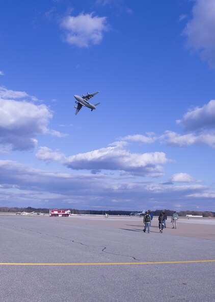 Col. Robert P. Graham, 512th Airlift Wing vice commander, flies over his friends and family before landing a C-17 Globemaster III during his final military flight, Dec. 1, 2016, Dover Air Force Base, Del. Graham has served in the Air Force since 1986 and logged more than 4,500 flight hours including 300 combat support hours. (U.S. Air Force Photo/ Tech. Sgt. Nathan Rivard)
