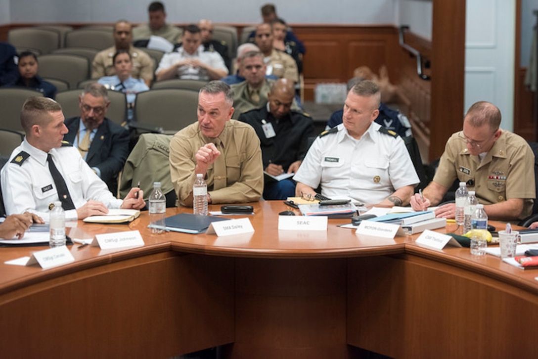 Marine Corps Gen. Joe Dunford, chairman of the Joint Chiefs of Staff, second from left, makes a point during a wide-ranging discussion with the Defense Senior Enlisted Leadership Council at the Pentagon, Dec. 1, 2016. To the left of the general is Sergeant Major of the Army Dan Dailey, to the right is Army Command Sgt. Maj. John W. Troxell, the senior enlisted advisor to the chairman, and Master Chief Petty Officer of the Navy Steven S. Giordano. The council consists of service and combatant command senior enlisted advisors. DoD photo by Navy Petty Officer 2nd Class Dominique A. Pineiro