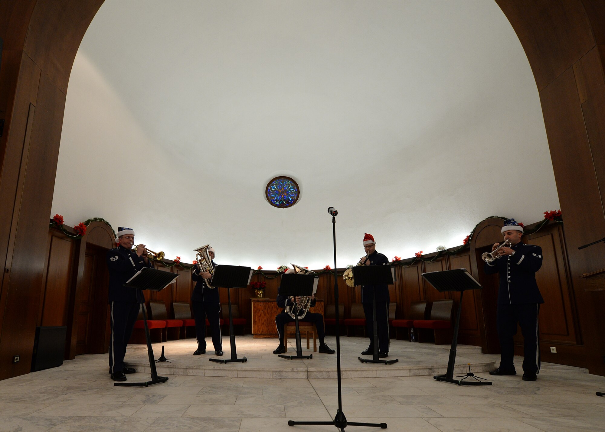 Members from Five Star Brass, a component of the United States Air Forces in Europe Band, play Christmas music at Vogelweh Military Complex, Germany, Nov. 29, 2016. Five Star Brass, played traditional Christmas music during the introduction of the ceremony as part of the program (U.S. Air Force photo by Senior Airman Jimmie D. Pike)