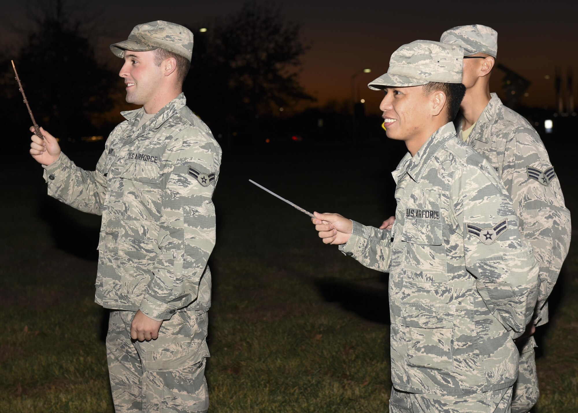 Airmen hold up homemade wands as part of the annual tree lighting event at Whiteman Air Force Base, Mo., Nov. 29, 2016. Attendees were encouraged to wave their wands to help light the decorations to kick off the holiday events. 