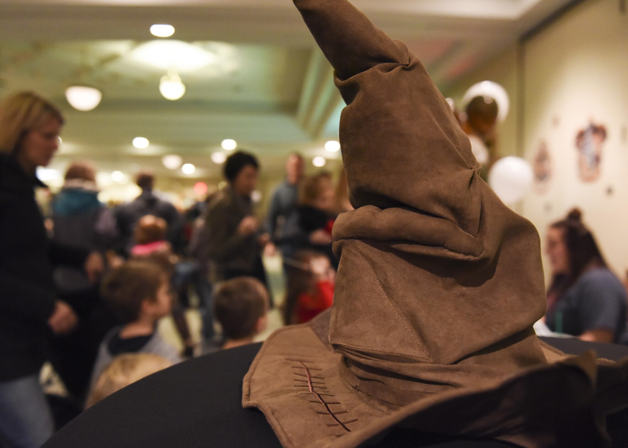 A talking hat used to sort children into their respective wizard houses waits on a table during the annual tree lighting event at Whiteman Air Force Base, Mo., Nov. 29, 2016. Children also had the opportunity to enjoy different aspects of the wizard-themed event, such as choosing a homemade wand and tasting questionable jelly bean flavors.