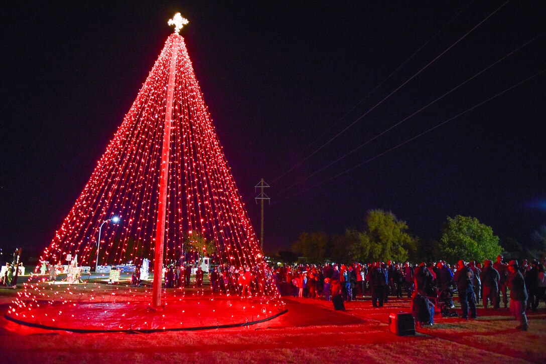 Airmen and families from Sheppard Air Force Base, Texas, gather round the holiday tree just after Brig. Gen. Patrick Doherty, 82nd Training Wing commander, and Chief Master Sgt. Joseph Pritchard, 82nd TRW command chief, lit the tree during the annual tree lighting ceremony, Dec. 1, 2016. Each year in December, Sheppard lights a commemorative tree in the spirit of diversity and celebrating the holidays. (U.S. Air Force photo by Senior Airman Kyle E. Gese)