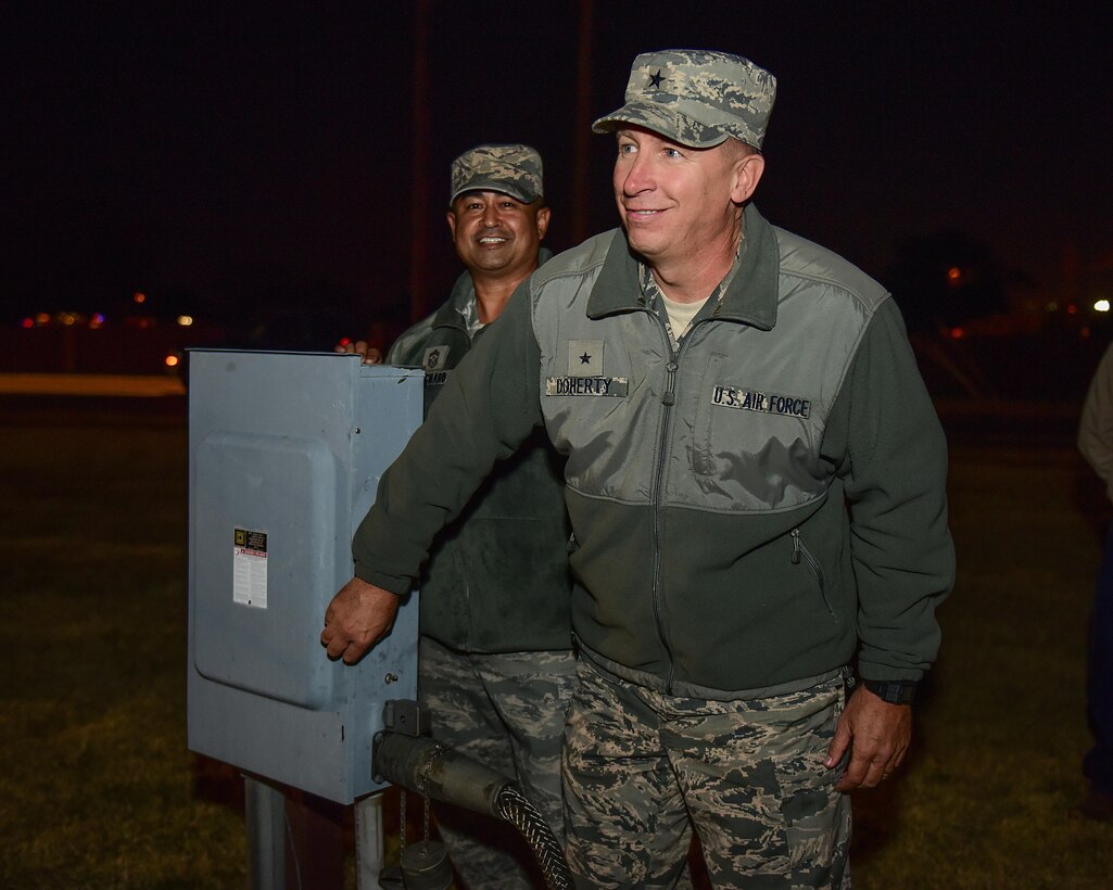 Brig. Gen. Patrick Doherty, 82nd Training Wing commander, and Chief Master Sgt. Joseph Pritchard, 82nd TRW command chief, light the holiday tree at Sheppard Air Force Base, Texas, Dec. 1, 2016. Each year in December, Sheppard lights a commemorative tree in the spirit of diversity and celebrating the holidays. (U.S. Air Force photo by Senior Airman Kyle E. Gese)