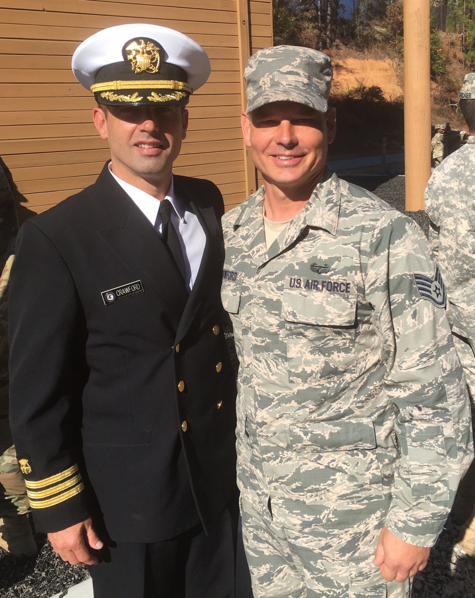 Staff Sgt. Kurtis Crawford, 512th Airlift Control Flight, Dover Air Force Base, Del., stands with his brother Navy Commander Todd Crawford, Department of Defense Health Services, Nov. 18, 2016, following Crawford's graduation from the Army's Air Assault School at Ft. Benning, Ga. Crawford's brother pinned on his air assault wings as part of the graduation ceremony. (U.S. Air Force/Courtesy Photo)