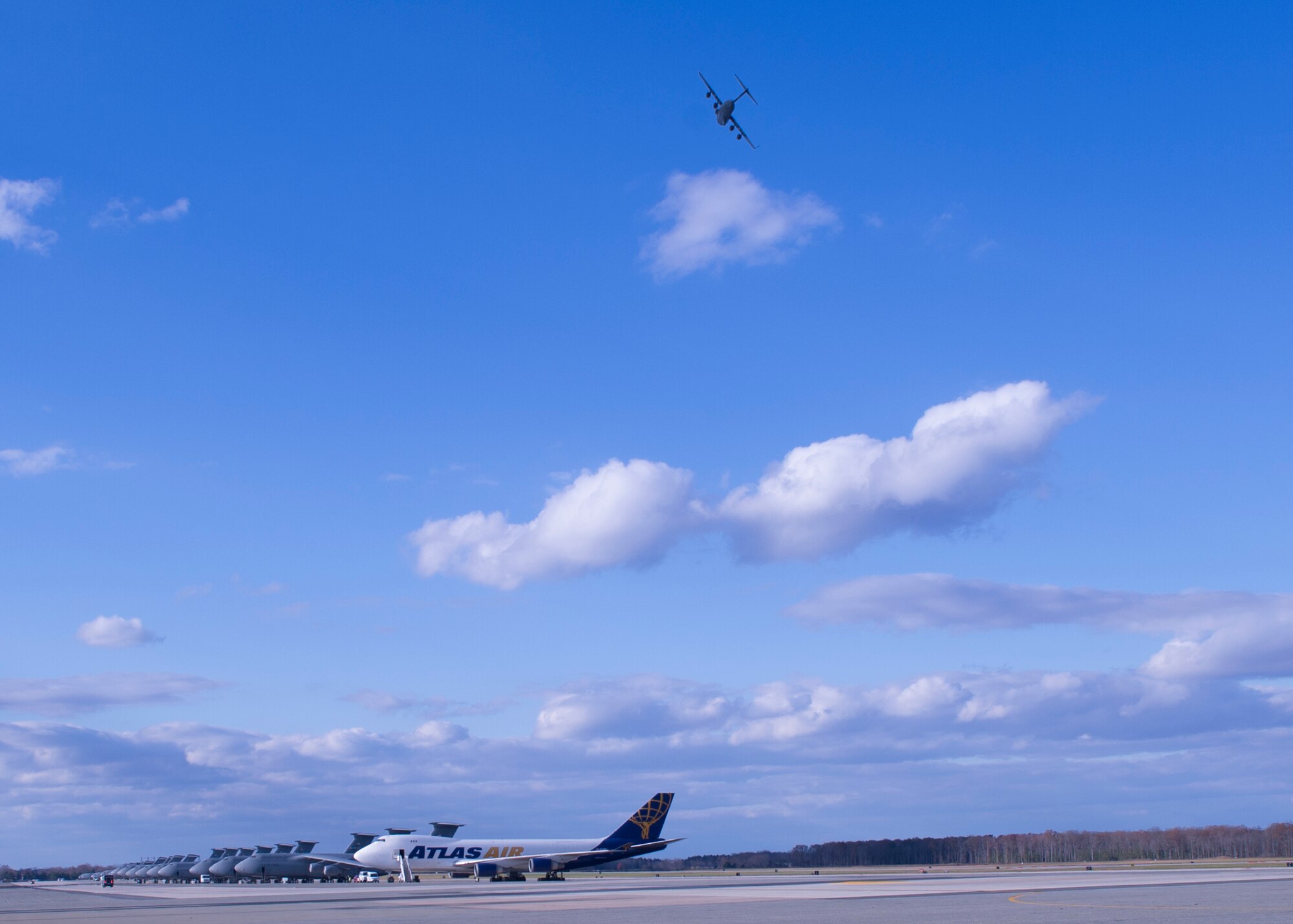 Col. Robert P. Graham, 512th Airlift Wing vice commander, flies over his friends and family before landing a C-17 Globemaster III during his final military flight, Dec. 1, 2016, Dover Air Force Base, Del. Graham has served in the Air Force since 1986 and logged more than 4,500 flight hours including 300 combat support hours. (U.S. Air Force Photo/ Tech. Sgt. Nathan Rivard)