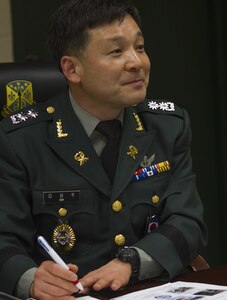 Col. Seung Ju Kim, deputy provost marshal for the Republic of Korea Army, visited the 200th Military Police Command to receive a briefing at Fort Meade, Maryland, Nov. 30. The briefing assessed how Military Police assets of the U.S. Army Reserve, such as the 200th MP Command, operate so that the Republic of Korea can incorporate M.P.'s in their own reserve army. This process benefits the U.S. strategically and tactically by creating interoperability, enhancing security and decreasing dependence on U.S. Forces. (U.S. Army Reserve photo by Sgt. Audrey Hayes)